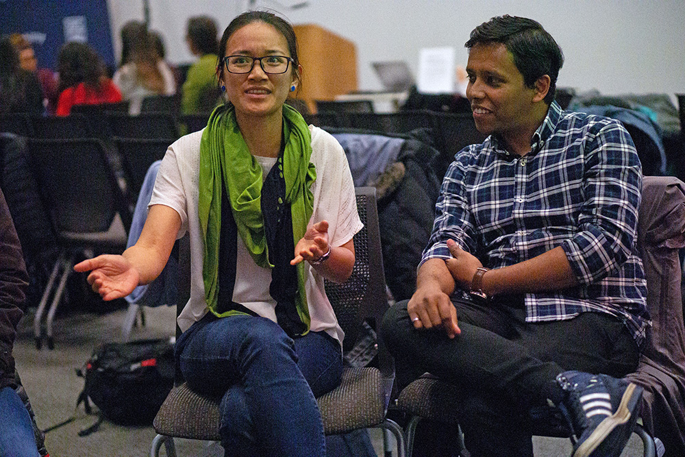 Two students in conversation at the workshop